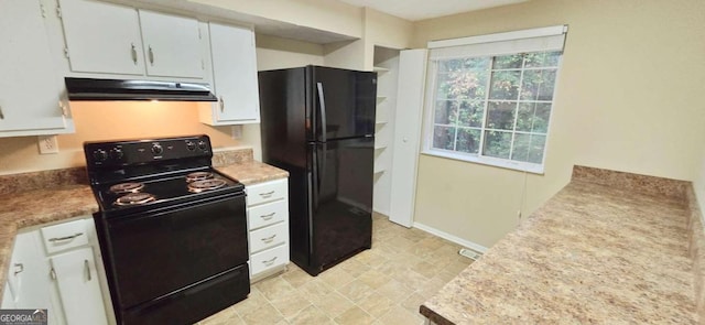 kitchen featuring black appliances and white cabinets