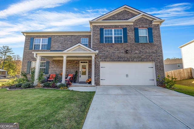 view of front of home featuring a front yard and a garage