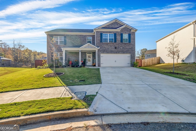 front of property featuring a front yard and a garage