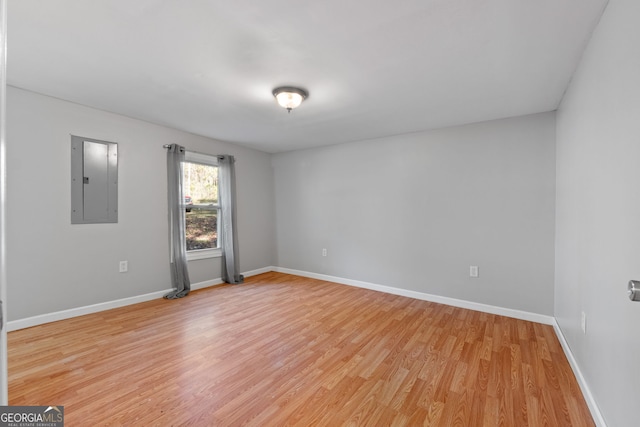 465 Haynie Rd, Moreland, GA 30259 - empty room featuring electric panel, light wood-style flooring, and baseboards