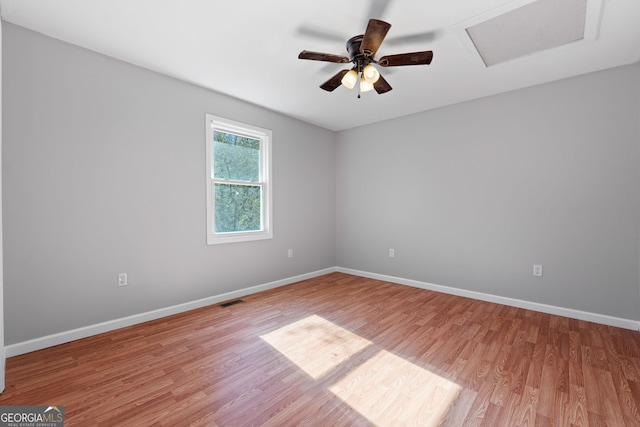 spare room with ceiling fan and light hardwood / wood-style floors