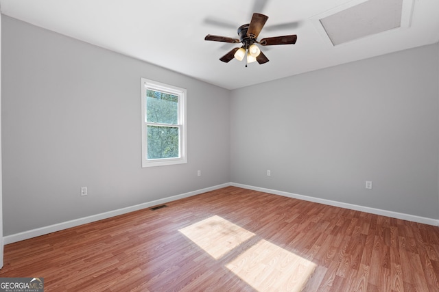 465 Haynie Rd, Moreland, GA 30259 - spare room with attic access, light wood finished floors, baseboards, and a ceiling fan