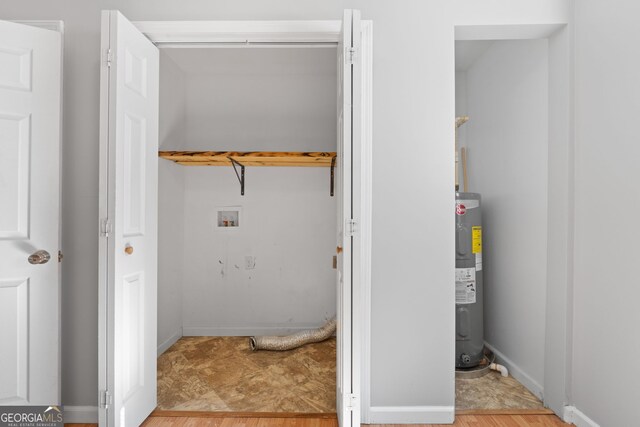 465 Haynie Rd, Moreland, GA 30259 - laundry area with washer hookup, water heater, and baseboards