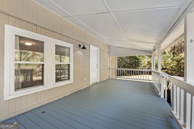 wooden deck featuring covered porch