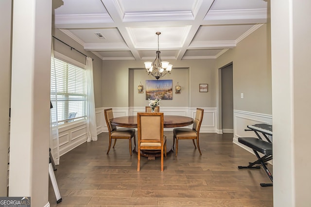 dining area featuring coffered ceiling, hardwood / wood-style flooring, ornamental molding, a notable chandelier, and beam ceiling