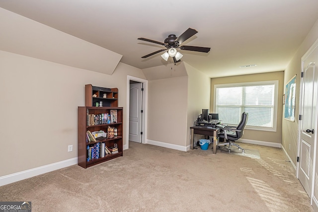 office featuring ceiling fan, lofted ceiling, and light carpet