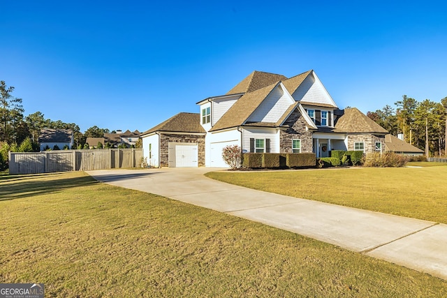 view of front of home featuring a garage and a front yard