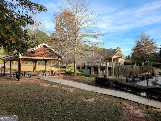 exterior space with a gazebo and a lawn