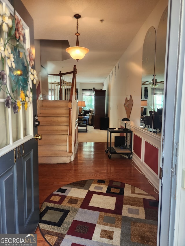 corridor featuring dark hardwood / wood-style flooring