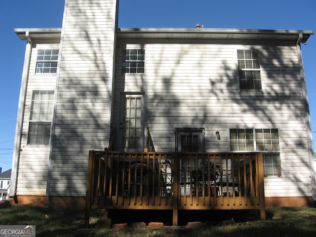 back of property featuring a deck