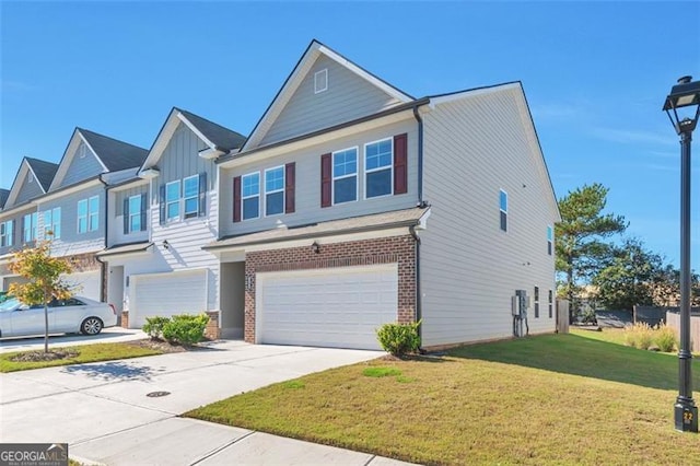 view of front of house with a garage and a front lawn