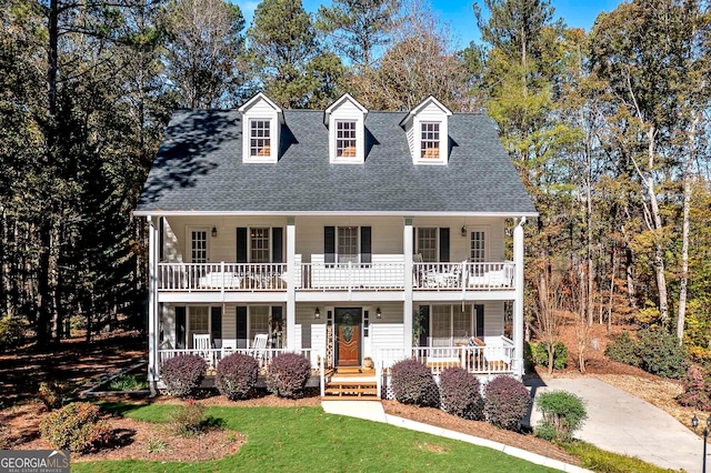 view of front of property featuring a balcony