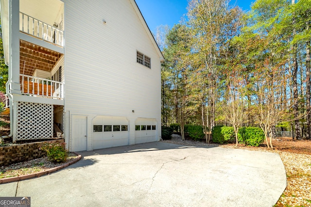 view of side of property featuring a garage