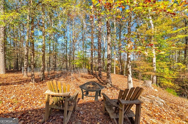 view of patio / terrace with an outdoor fire pit