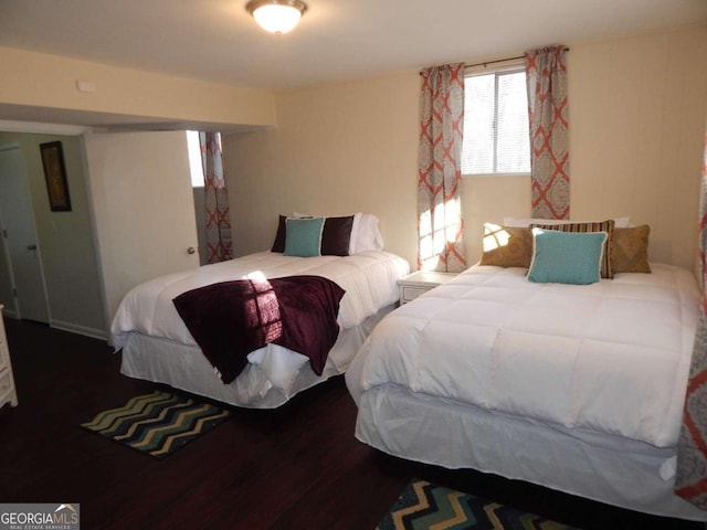 bedroom with hardwood / wood-style flooring