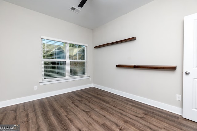 spare room featuring dark hardwood / wood-style floors