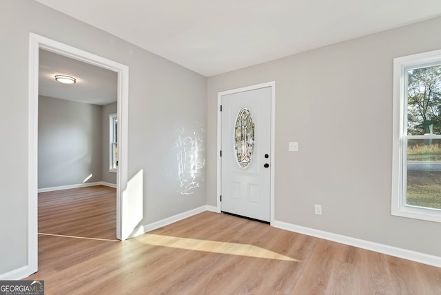 foyer with light wood-type flooring