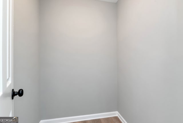 spare room with hardwood / wood-style flooring