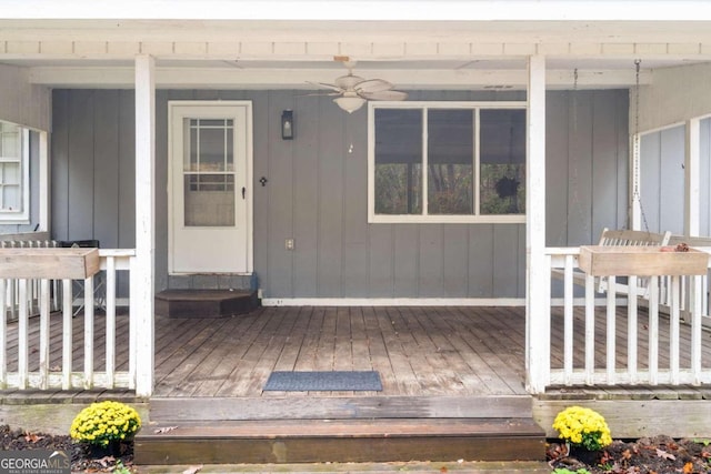 view of exterior entry with ceiling fan