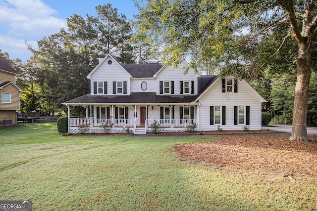 view of front of property featuring a porch and a front lawn