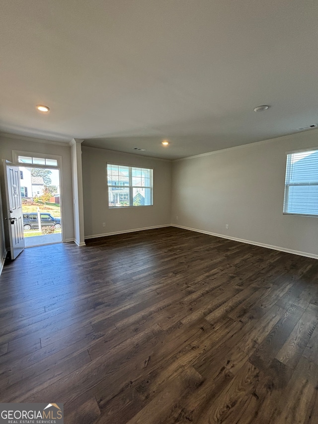 unfurnished room featuring dark hardwood / wood-style flooring