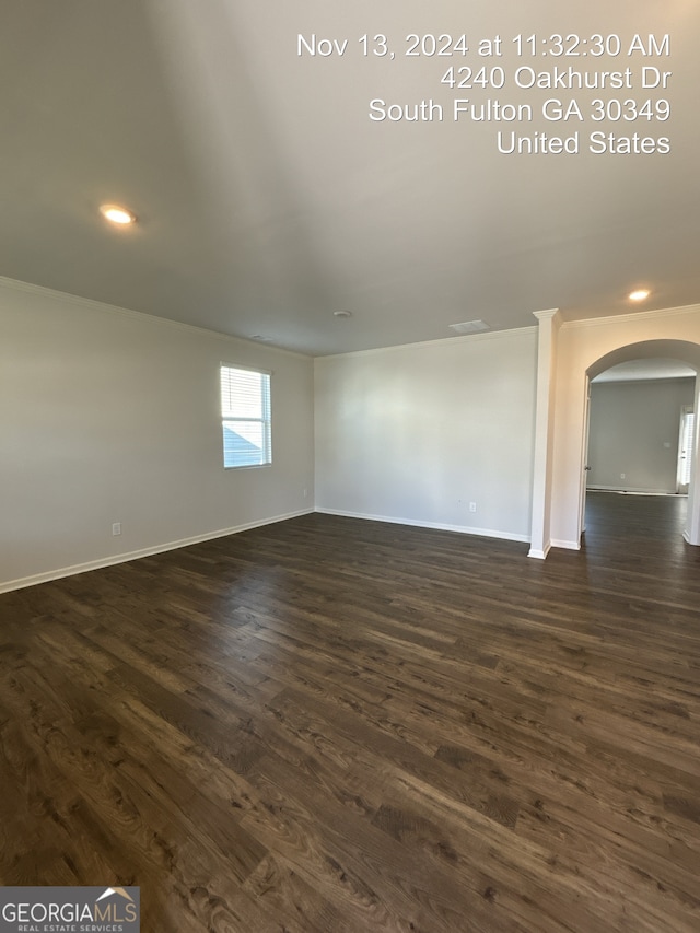 spare room with dark hardwood / wood-style flooring