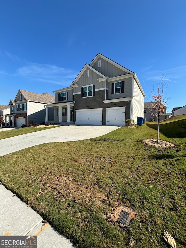 view of front of home featuring central air condition unit, a front yard, and a garage