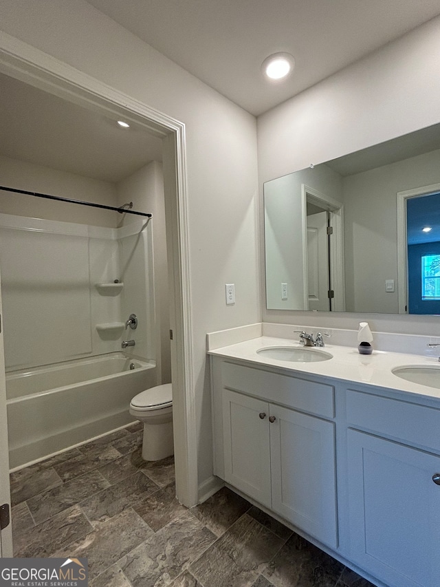 full bathroom with vanity, bathtub / shower combination, and toilet