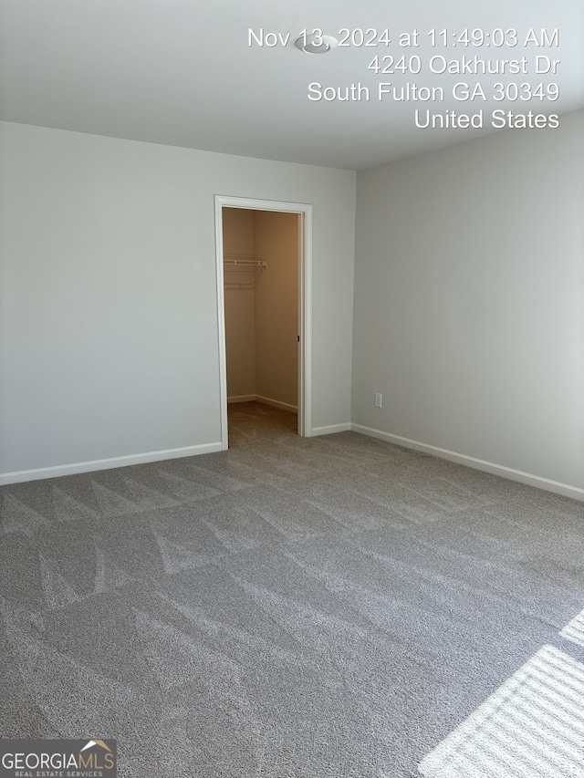 unfurnished room with carpet flooring