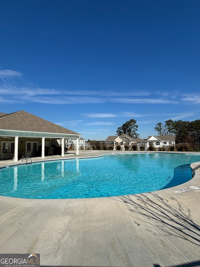 view of swimming pool with a patio