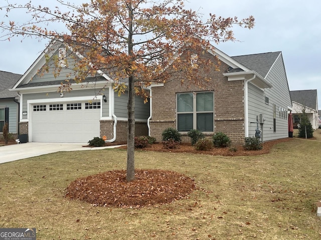 view of front of house with a garage and a front yard