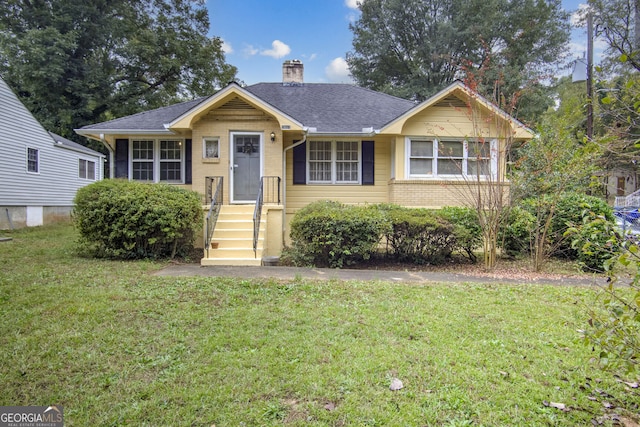 view of front of home with a front yard