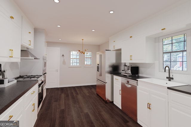 kitchen featuring sink, white cabinets, dark hardwood / wood-style floors, and appliances with stainless steel finishes