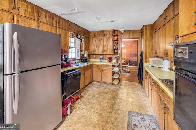 1778 Campbellton Rd SW, Atlanta, GA 30311 - kitchen featuring black appliances, light flooring, wooden walls, open shelves, and light countertops