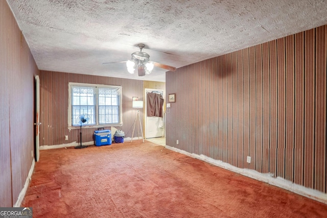 1778 Campbellton Rd SW, Atlanta, GA 30311 - carpeted empty room featuring ceiling fan, baseboards, a textured ceiling, and wooden walls