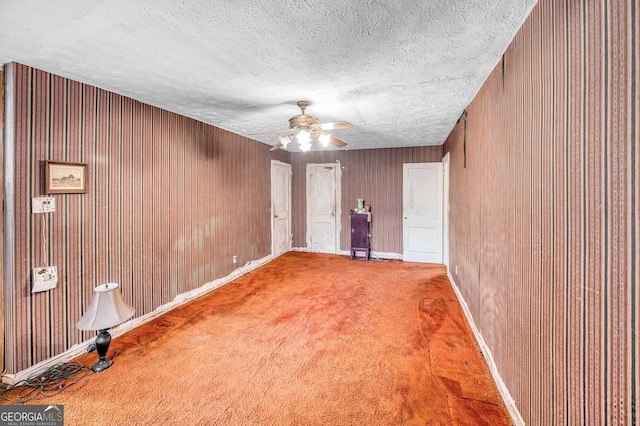 1778 Campbellton Rd SW, Atlanta, GA 30311 - unfurnished room featuring carpet flooring, a ceiling fan, wood walls, baseboards, and a textured ceiling