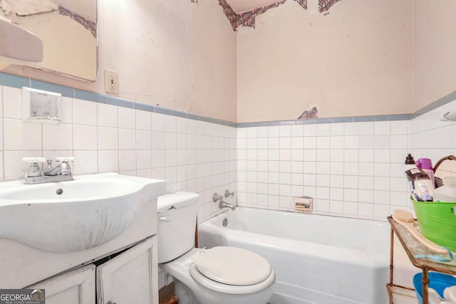 1778 Campbellton Rd SW, Atlanta, GA 30311 - bathroom with tile walls, a tub, toilet, and vanity