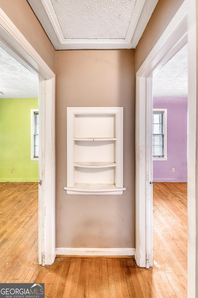 1778 Campbellton Rd SW, Atlanta, GA 30311 - hall with hardwood / wood-style flooring, baseboards, and a textured ceiling