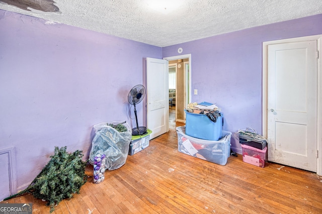 1778 Campbellton Rd SW, Atlanta, GA 30311 - bedroom featuring a textured ceiling and hardwood / wood-style flooring