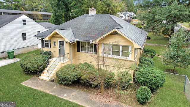 1778 Campbellton Rd SW, Atlanta, GA 30311 - view of front of house with a chimney, a shingled roof, and brick siding