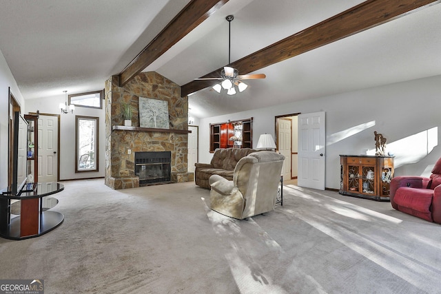 carpeted living room featuring lofted ceiling with beams, a stone fireplace, and ceiling fan