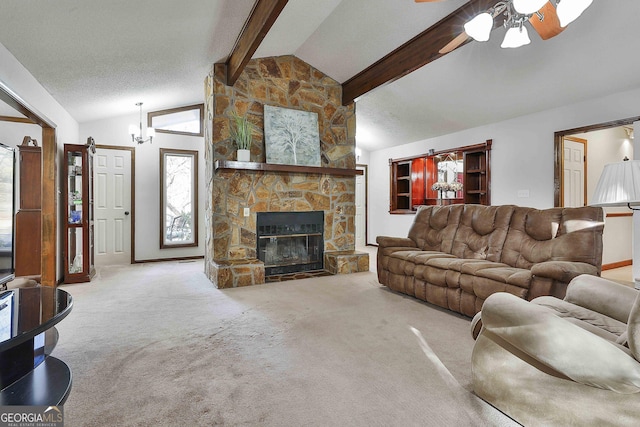 carpeted living room with vaulted ceiling with beams, ceiling fan, a stone fireplace, and a textured ceiling