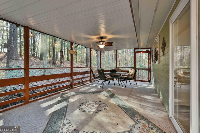 sunroom / solarium with ceiling fan