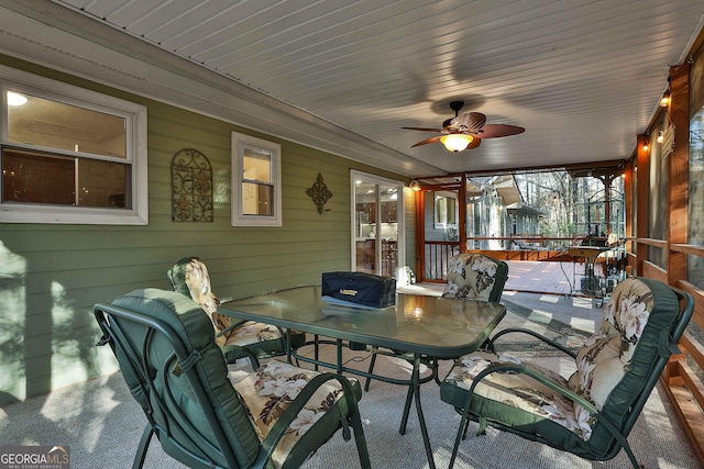 sunroom / solarium with ceiling fan