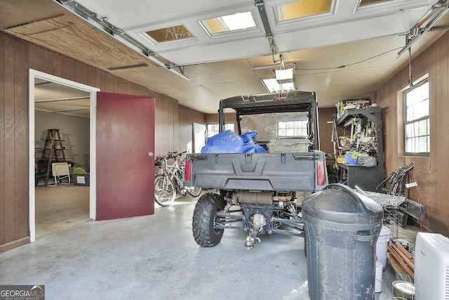 garage featuring wood walls