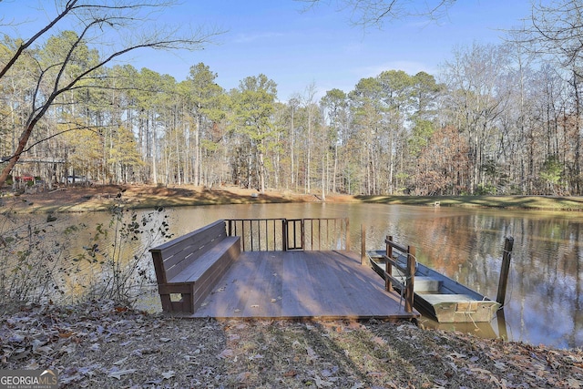 view of dock with a deck with water view