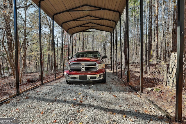 view of vehicle parking with a carport