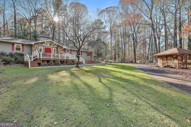 view of yard featuring a wooden deck