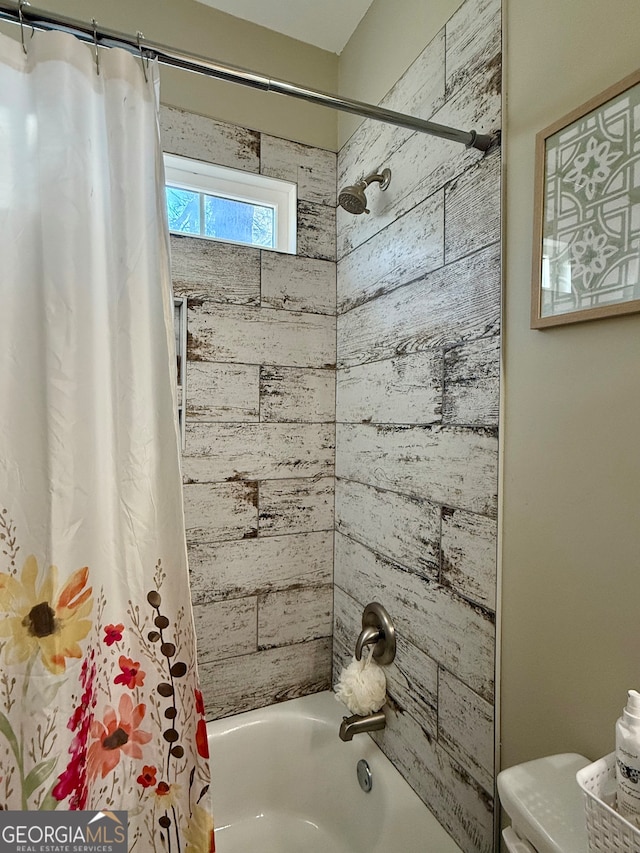 bathroom with toilet and shower / bathtub combination with curtain