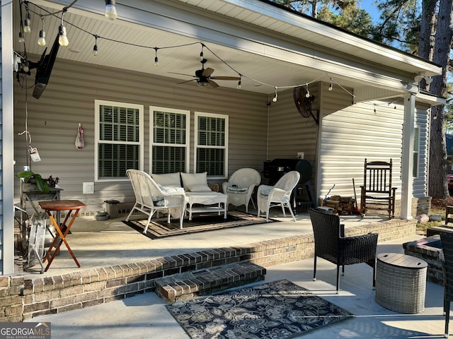 view of patio / terrace with an outdoor living space and ceiling fan